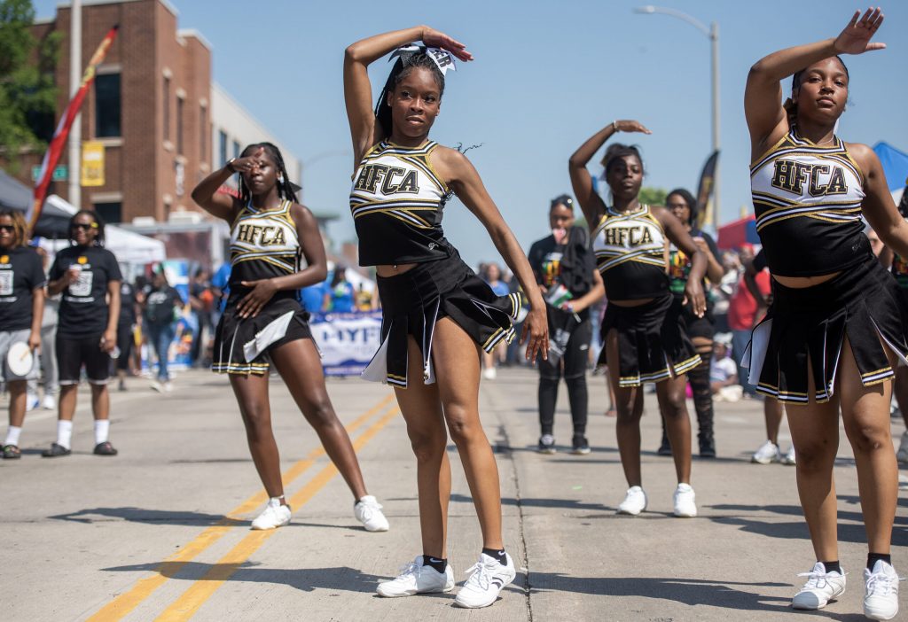 Cheerleaders from Dr. Howard Fuller Collegiate Academy in Milwaukee perform at the Juneteenth Jubilee Parade on Thursday, June 19, 2025, in Milwaukee, Wis. Angela Major/WPR