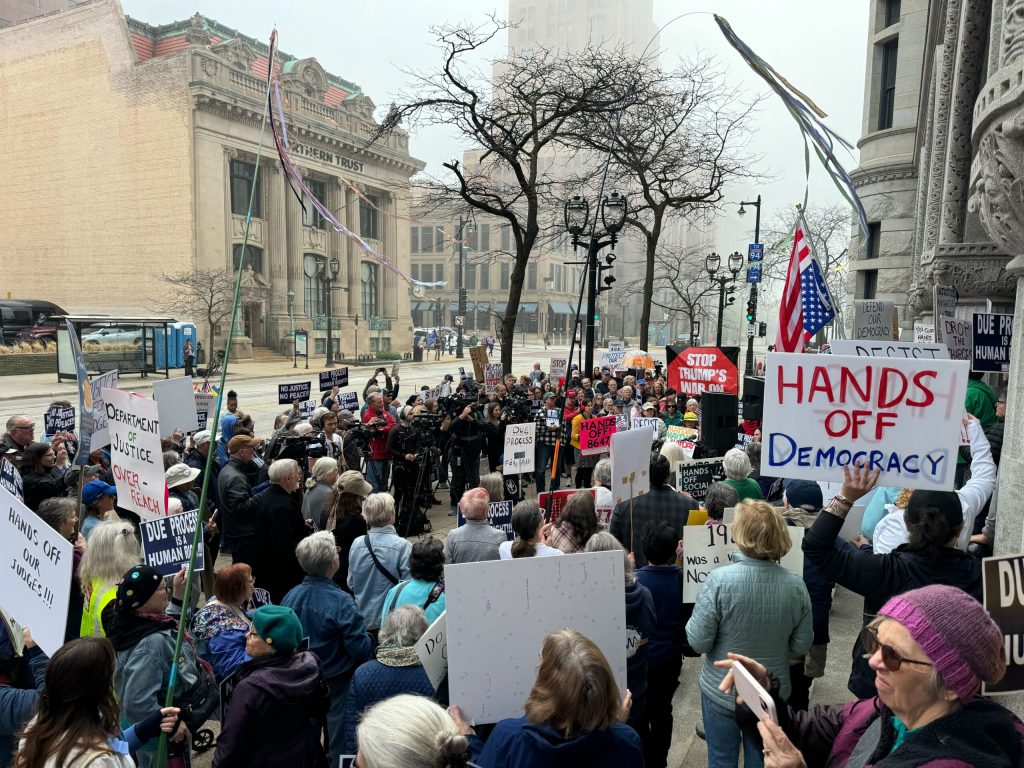 Outside of the courthouse in downtown Milwaukee, more than 100 protesters gathered before a hearing Thursday, May 15, 2025 to speak out against Judge Hannah Dugan’s arrest. Evan Casey/WPR