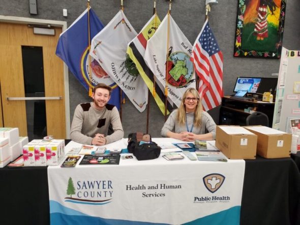 Jake White, on the left, and public health nurse Mary Slisz-Chucka represented Sawyer County Public Health at a community health fair on the campus of Lac Courte Oreilles Ojibwe University in March. (Photo courtesy of Jake White)