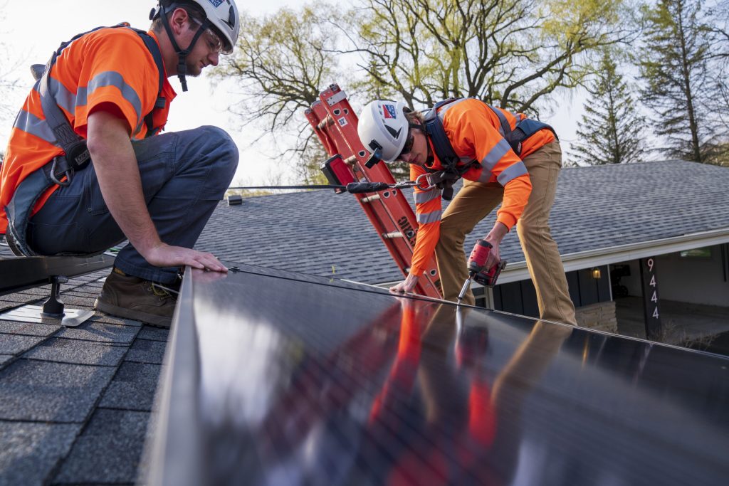 Contractors with Arch Solar install rooftop solar panels on a home in southeastern Wisconsin. Photo courtesy of Arch Solar