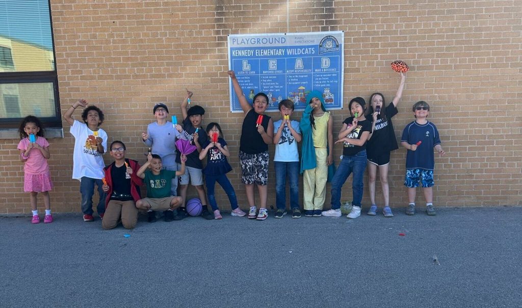 Students with the community learning center at Kennedy Elementary School in Green Bay pose outside. Photo courtesy the Green Bay Area School District