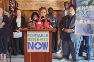 At a news conference Tuesday in the state Capitol, Rachel Smith of New Berlin speaks in favor of a bill that would make app-based drivers independent contractors and allow the businesses they drive for to provide some benefits. The bill was authored by Sen. Julian Bradly, on the right. (Photo by Erik Gunn/Wisconsin Examiner)