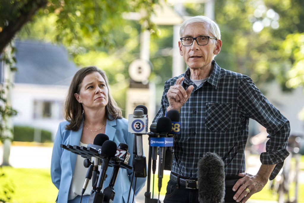 Gov. Tony Evers speaks to reporters with Sara Rodriguez, a member of the state Assembly and Democratic candidate for lieutenant governor, on Wednesday, Aug. 10, 2022, in Madison, Wis. Angela Major/WPR