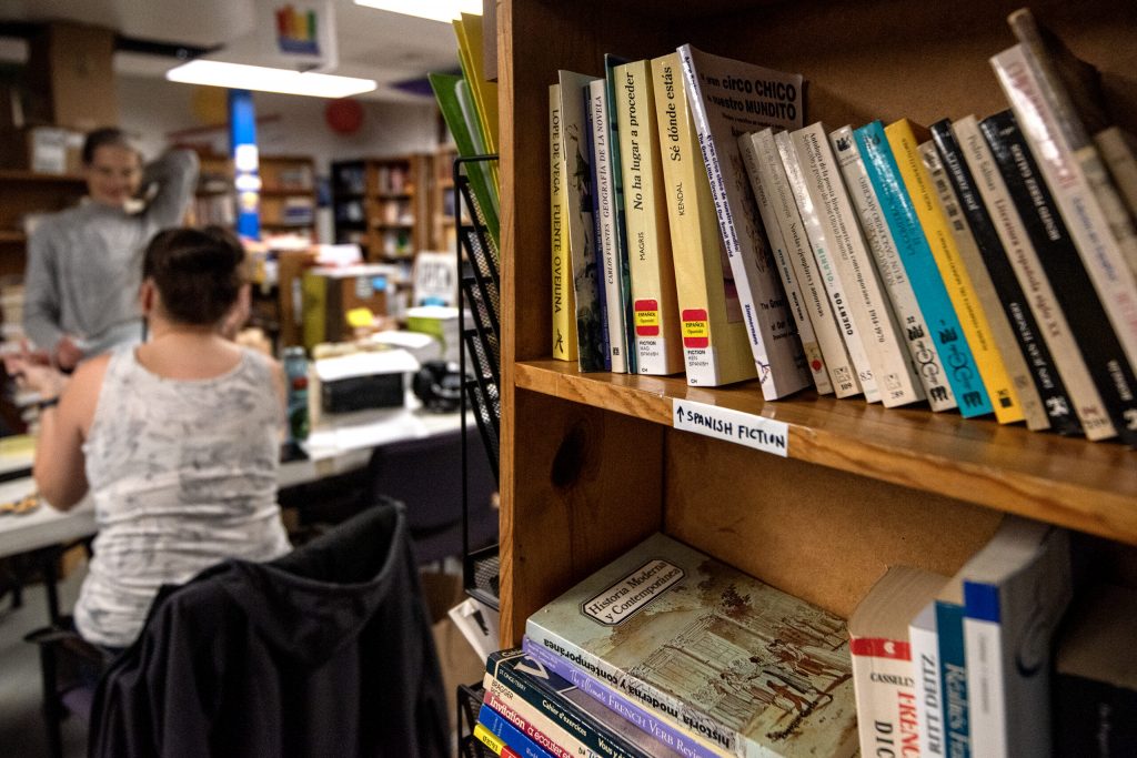 Books are organized on shelves in Madison, Wis. on Wednesday, Jan. 25, 2023, as volunteers with a nonprofit called Wisconsin Books to Prisoners prepare to mail out free copies to people incarcerated in Wisconsin. Angela Major/WPR