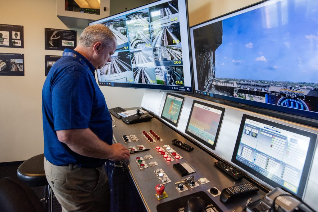 Mike Brockman, vice president of facilities and projects, approaches the controls for the roof Monday, June 23, 2025, at American Family Field in Milwaukee, Wis. Angela Major/WPR