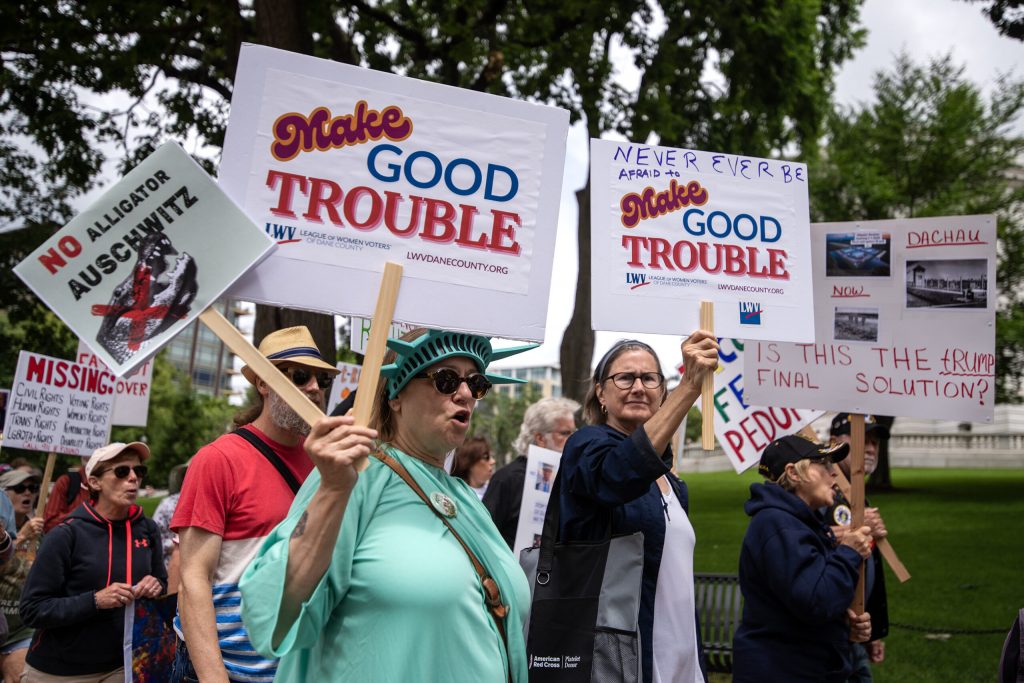 Anti-Trump protesters make their way around the Wisconsin State Capitol on Thursday, July 17, 2025, in Madison, Wis. Angela Major/WPR