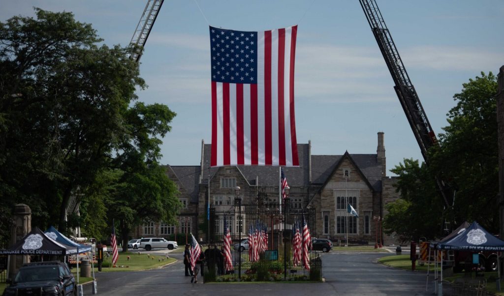 An American Flag is displayed at the Wisconsin Memorial Park at a funeral for Milwaukee Police Officer Kendall Corder on July 11, 2025. Angela Major/WPR