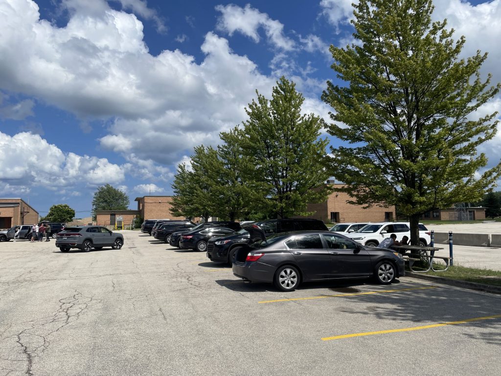 Milwaukee Mitchell International Airport’s rideshare staging lot on June 27, 2025. Nick Rommel/WPR