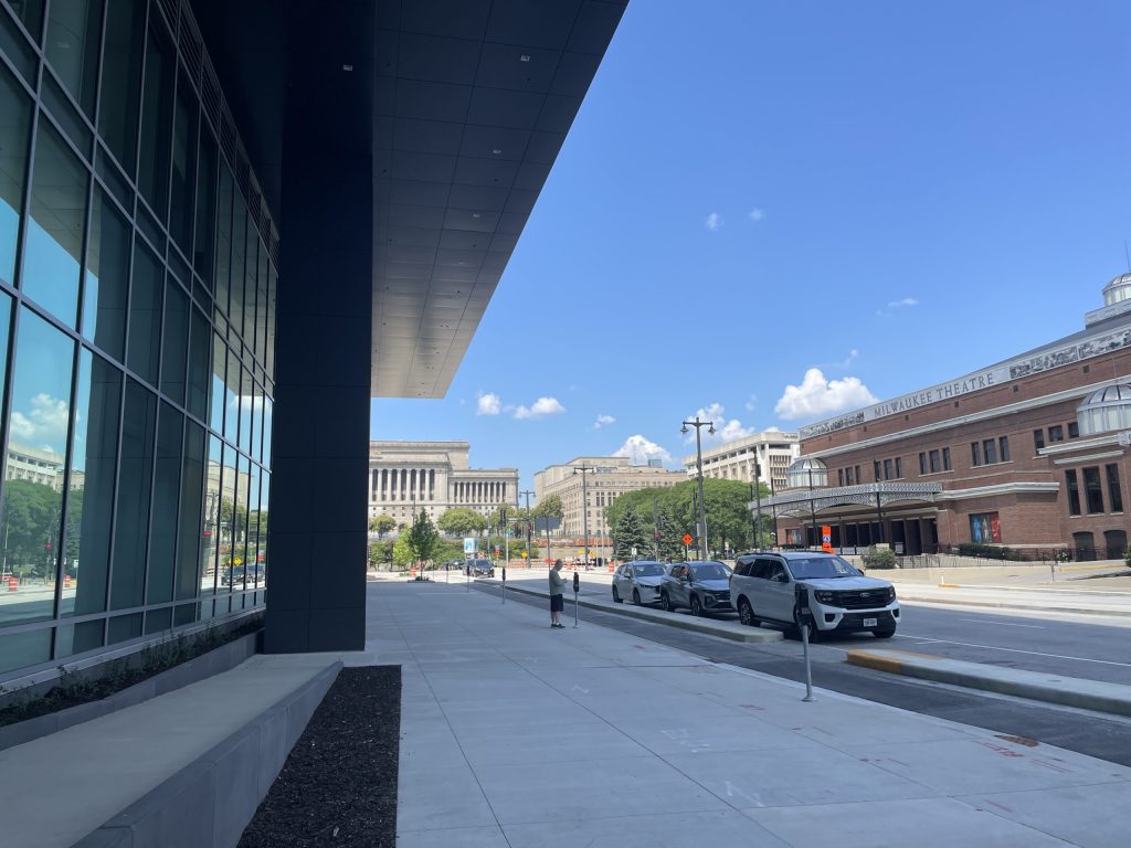 Milwaukee’s Baird Center, left, is near the Milwaukee County Courthouse complex and the Miller High Life Theater in downtown Milwaukee, pictured here on July 2, 2025. Nick Rommel/WPR
