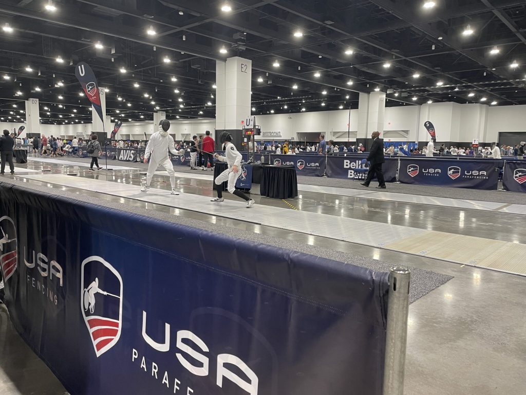 Fencers compete at the USA Fencing National Championship in Milwaukee’s Baird Center on July 2, 2025. Nick Rommel/WPR