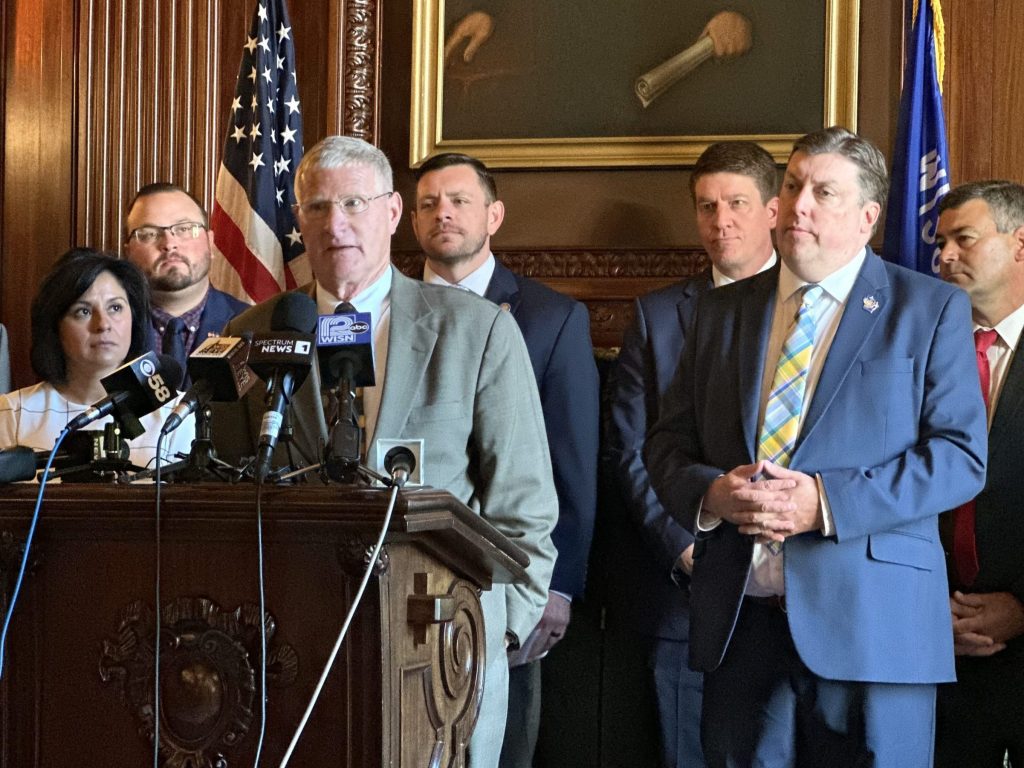 Joint Finance Committee Co-Chair Sen. Howard Marklein, R-Spring Green, flanked by other Republican committee members, shares details of a bipartisan budget deal in the Parlor of the Wisconsin State Senate on Tuesday, July 1, 2025. Anya van Wagtendonk/WPR
