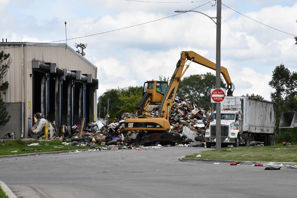 Debris picked up as part of the city's post-flood bulky item pickup. Photo by Jeramey Jannene.