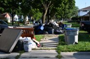 Water-damaged debris on N. 19th Street. Photo by Jeramey Jannene.