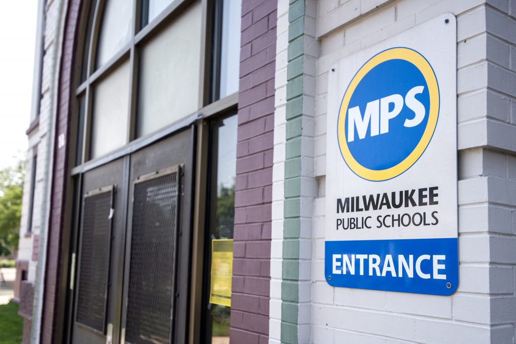 A sign for Milwaukee Public Schools is displayed Monday, July 7, 2025, outside of Westside Academy in Milwaukee, Wis. Angela Major/WPR