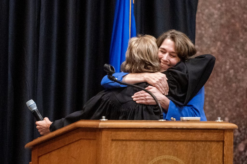 Wisconsin Supreme Court Justice Susan Crawford, right, hugs Chief Justice Jill Karofsky on Friday, Aug. 1, 2025, during Crawford’s investiture at the Wisconsin State Capitol in Madison, Wis. Angela Major/WPR