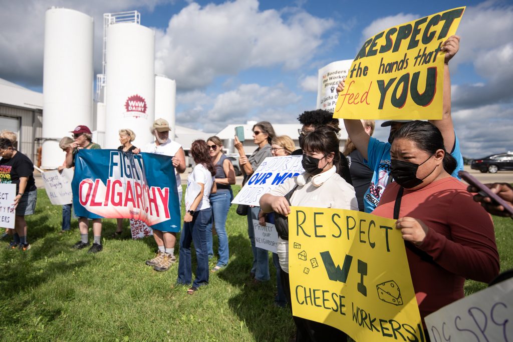 Protesters gather in support of striking workers Tuesday, Aug. 19, 2025, at W&W Dairy in Monroe, Wis. Angela Major/WPR