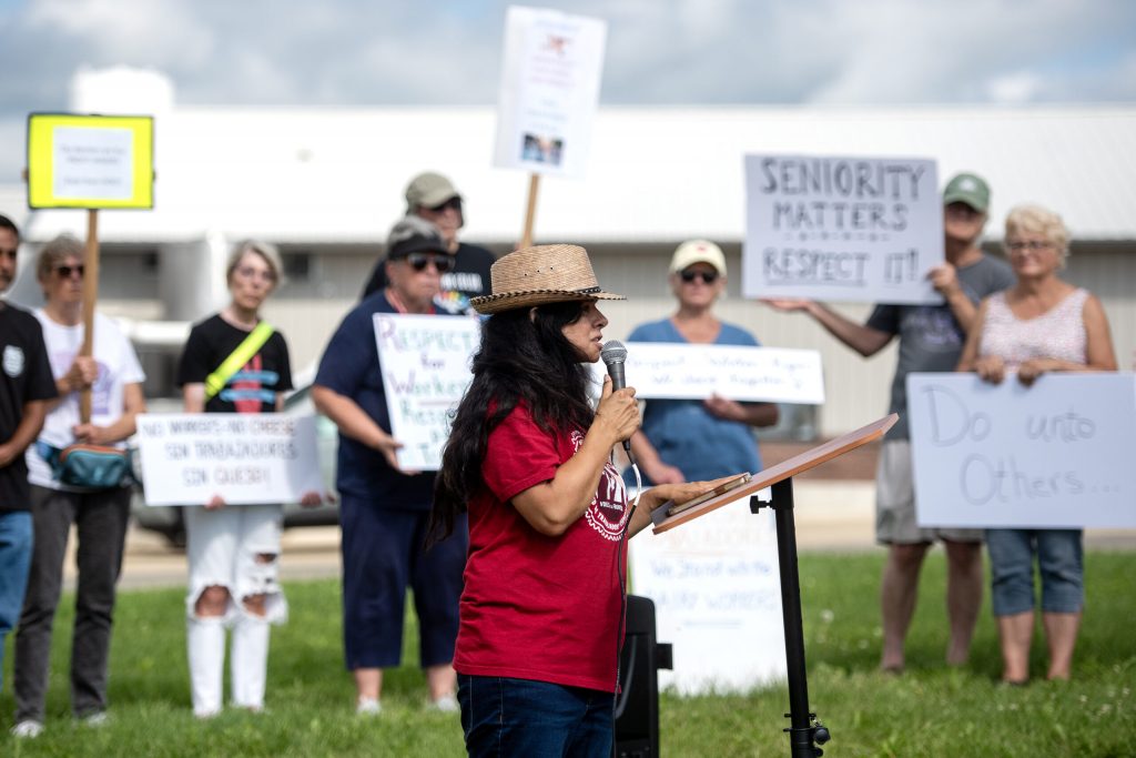 Christine Neumann-Ortiz, co-founder and executive director of Voces de la Frontera, speaks at a protest for striking workers Tuesday, Aug. 19, 2025, at W&W Dairy in Monroe, Wis. Angela Major/WPR