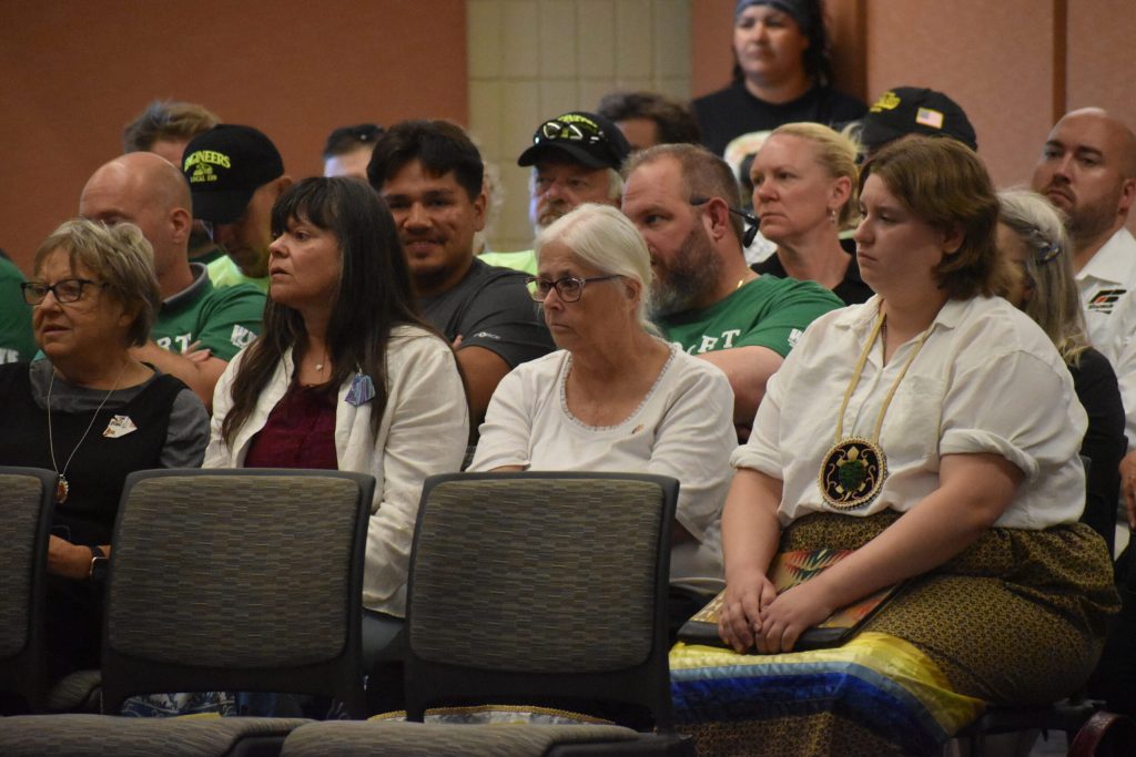 Opponents and supporters of the Line 5 relocation project attend a contested case hearing in Ashland on Aug. 12, 2025. The Bad River tribe and environmental groups are challenging key permits for the project. Danielle Kaeding/WPR