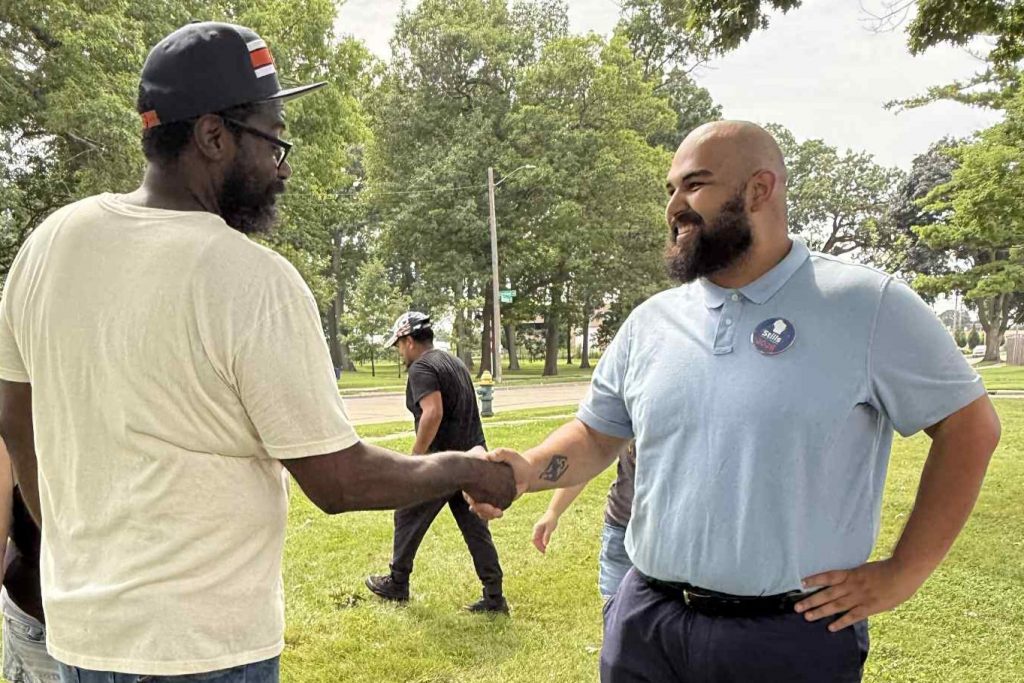 Democrat Gage Stills, right, meets with voters and a recent event for his 1st Congressional District campaign. (Stills Congressional Campaign photo)