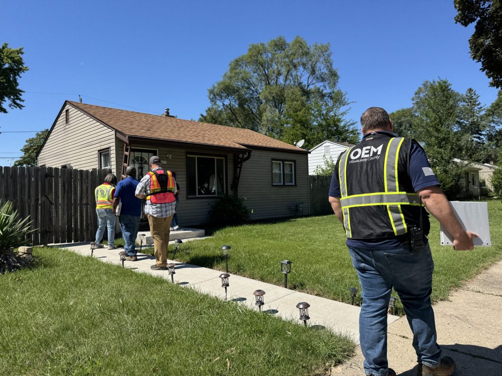 Staff with FEMA are seen here in Milwaukee on Thursday, Aug. 21, 2025. Evan Casey/WPR
