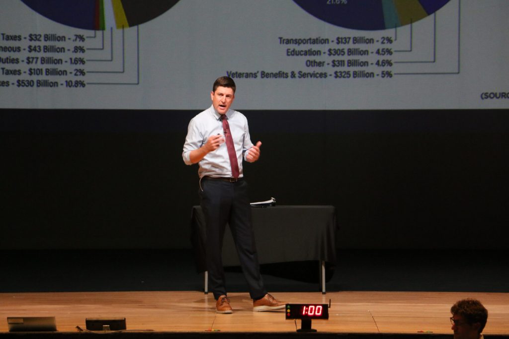 Republican U.S. Rep. Bryan Steil addresses a mostly hostile audience on Thursday, July 31, 2025 in Elkhorn, Wis. during his first in-person town hall forum since the passage of President Donald Trump’s “Big Beautiful Bill Act.” During the event, attendees booed and jeered when he voiced support for Trump’s policies. Rich Kremer/WPR