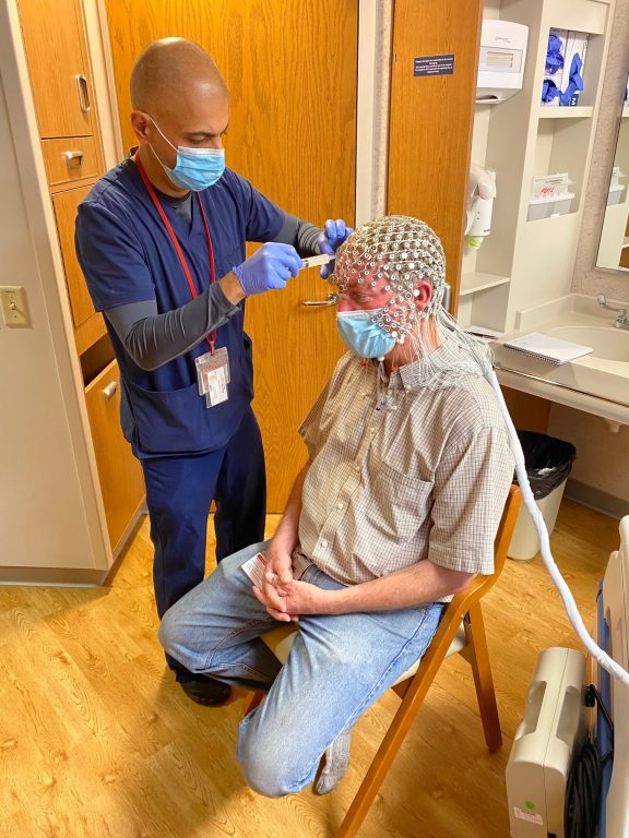 UW-Madison professor Charles Raison (wearing an electroencephalogram cap) conducts studies on consciousness and psychedelics. Photo courtesy of the Raison lab