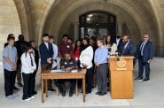 Mayor Cavalier Johnson signs the 2024-2025 Youth Council CDBG recommendations. Photo by Jeramey Jannene.