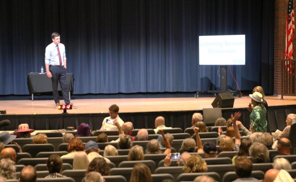 Republican U.S. Rep. Bryan Steil takes questions from constituents during a contentious town hall, Thursday, at the Elk Horn High School auditorium. Throughout the evening the congressman was drowned out by boos and jeers from audience members in Steil’s first in-person town hall since the passage of President Donald Trump’s “big beautiful bill act.” Rich Kremer/WPR