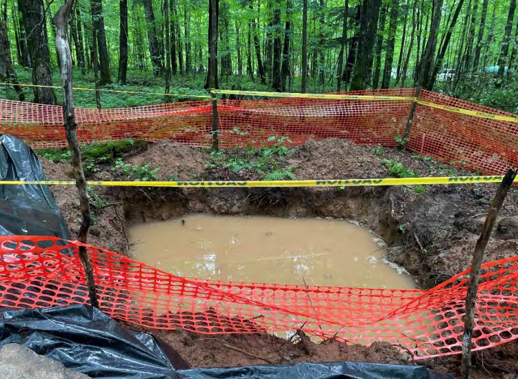 The Wisconsin DNR says standing water in a pit or sump was determined to be rainwater, not groundwater as some residents have feared. Screenshot from DNR inspection report