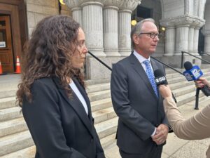 Attorney’s Jasmyne Baynard (left) and Joseph Wirth talk to press outside the federal courthouse (Photo by Isiah Holmes/Wisconsin Examiner)