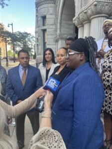 The Cole family and attorneys talk to press outside the federal courthouse. (Photo by Isiah Holmes/Wisconsin Examiner)
