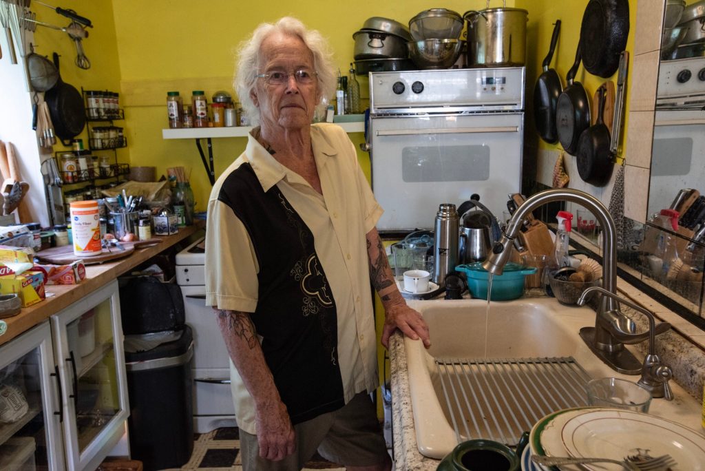 Mark Brueggeman of Nelsonville stands in front of the kitchen sink where he had a reverse osmosis system installed in 2018 to address nitrate contamination. Photo courtesy of Clean Wisconsin