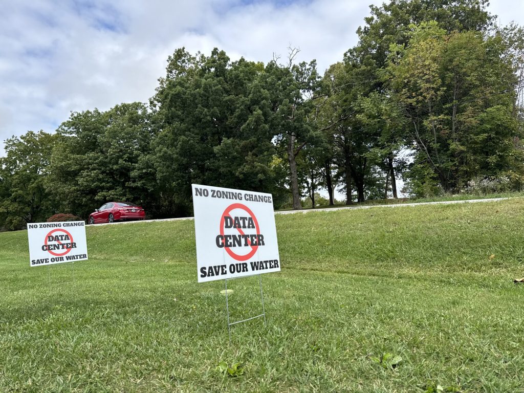 Signs against the proposed data center plans in Caledonia are seen here in the village on Sept. 24, 2025. Evan Casey/WPR