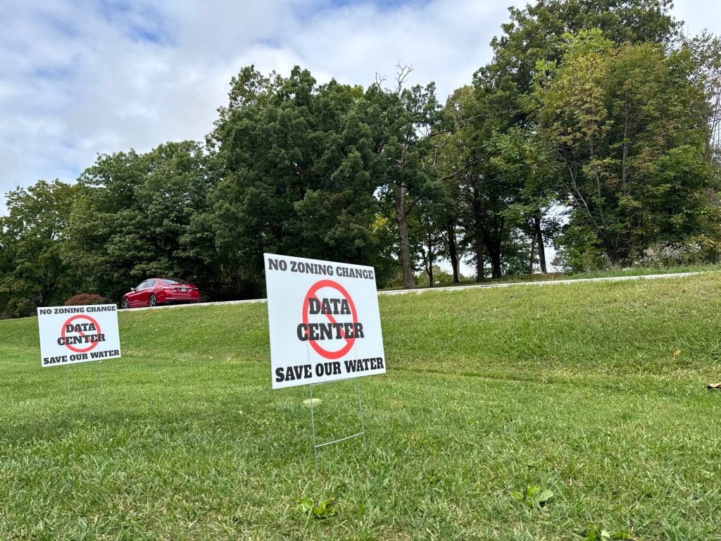Signs against the proposed data center plans in Caledonia are seen here in the village on Sept. 24, 2025. Evan Casey/WPR