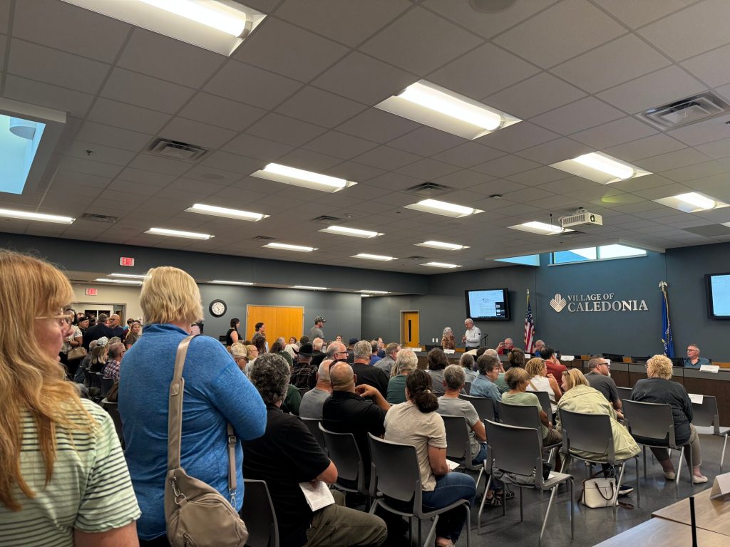 Over 100 people packed into a village of Caledonia meeting on Monday, Sept. 29, 2025. Evan Casey/WPR