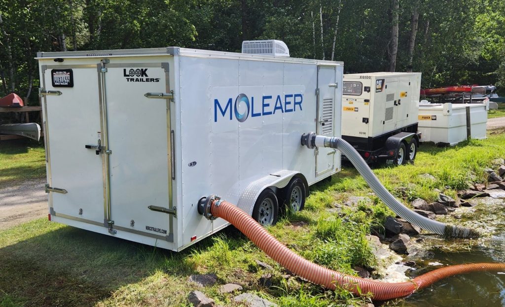 A trailer containing a Moleaer unit pumps in water from a marina on Lake Arrowhead in Rome, Wis., adding nanobubbles of oxygen to the water before pumping it back into the lake. Photo courtesy of Moleaer