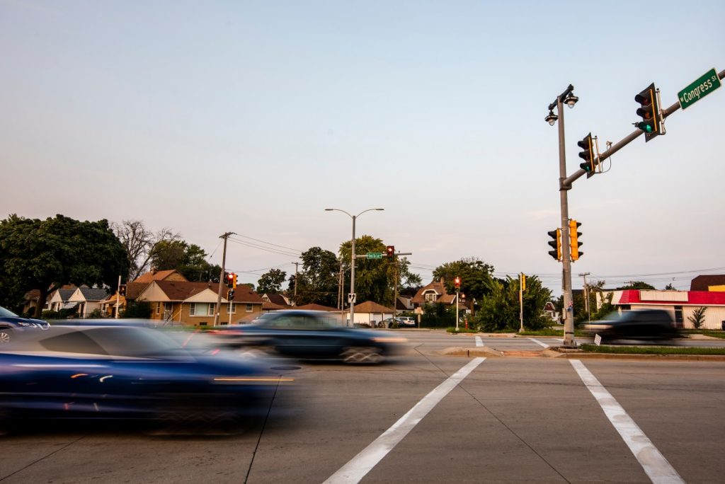 Vehicles drive on West Fond du Lac Avenue at its intersection with West Congress Street on Sept. 14, 2022, in Milwaukee, Wis. Angela Major/WPR