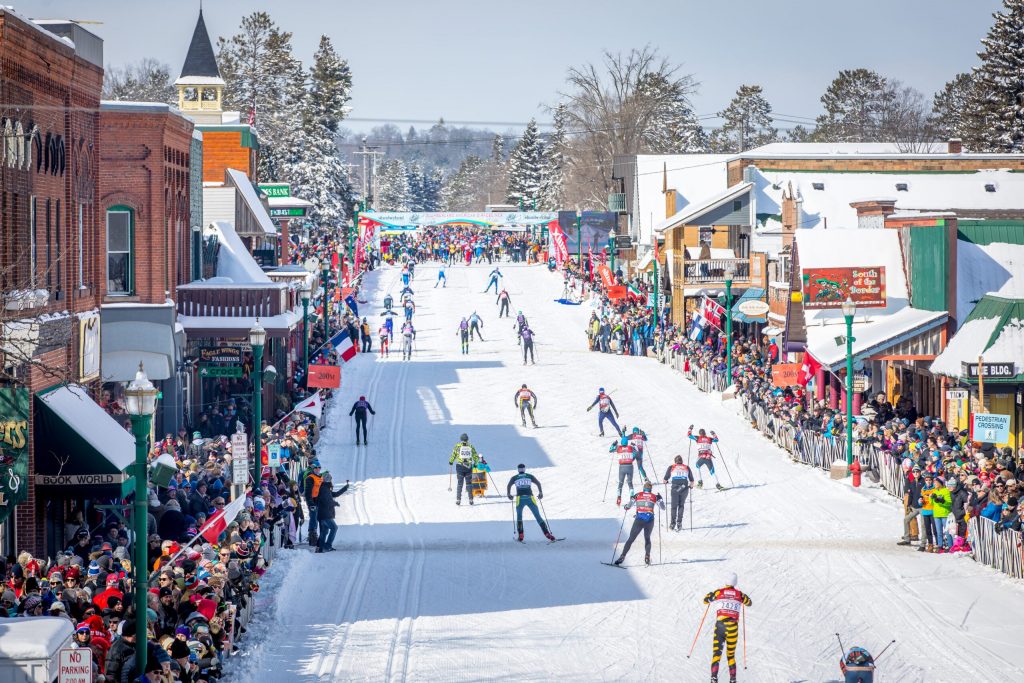Participants race toward the finish line in 2018. Spectators, using a race app on their phones, can track friends and family by bib number almost to the minute they will reach the Main Street finish. Photo courtesy of American Birkebeiner Foundation