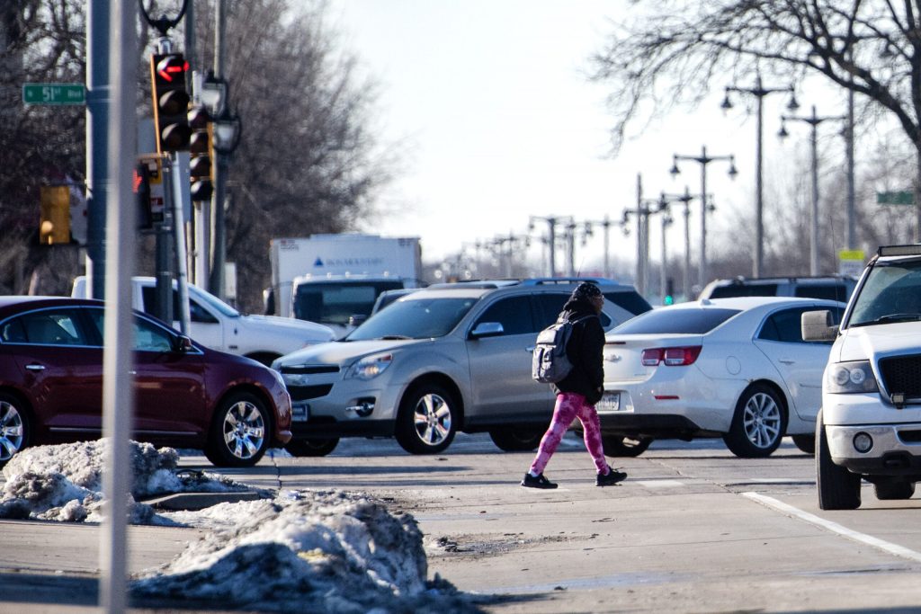 A pedestrian crosses West Fond Du Lac Ave. at an intersection on Thursday, Feb. 1, 2024, in Milwaukee, Wis. Angela Major/WPR