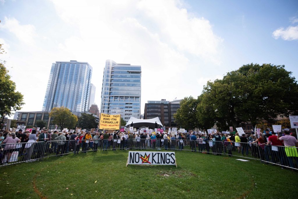 Protesters gather in opposition to President Donald Trump during a No Kings Protest on Saturday, Oct. 18, 2025, at Cathedral Square Park in Milwaukee, Wis. Angela Major/WPR