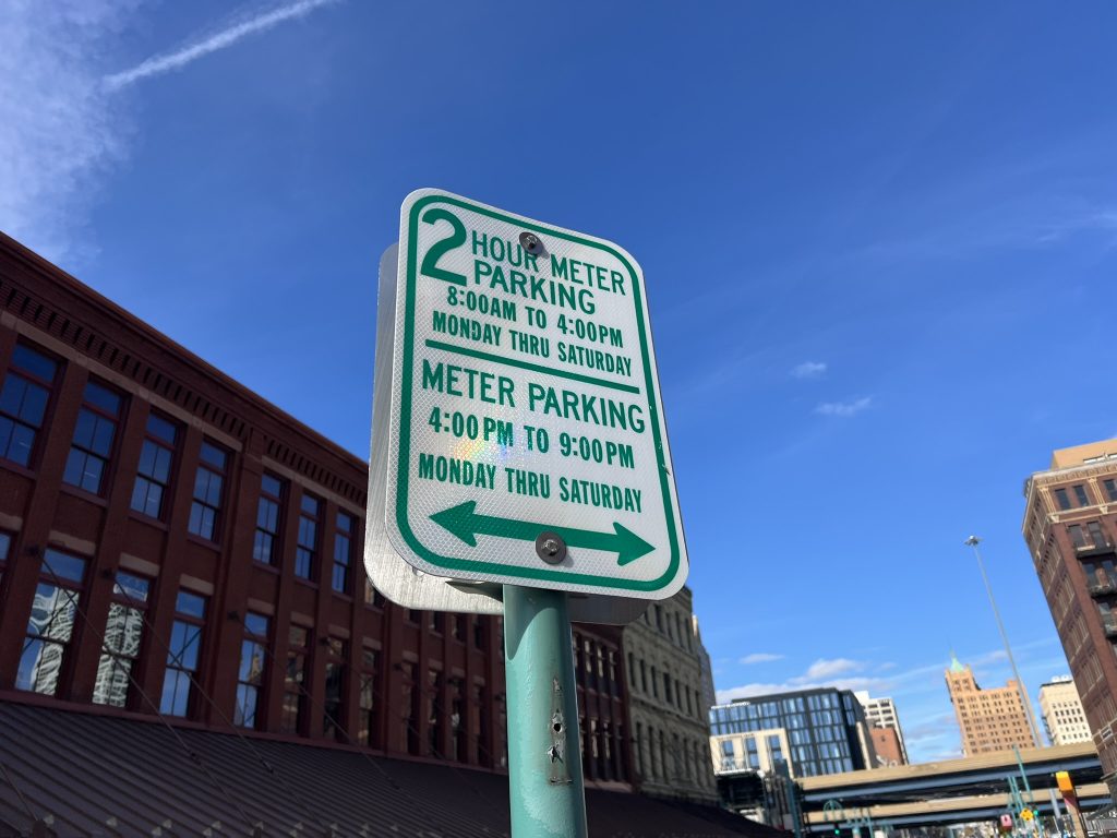 Extended meter hours in the Historic Third Ward. Photo by Jeramey Jannene.