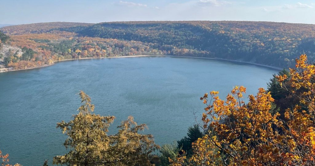 Fall leaves change color around the lake at Devil’s Lake State Park in November 2022. Alyssa Allemand/WPR