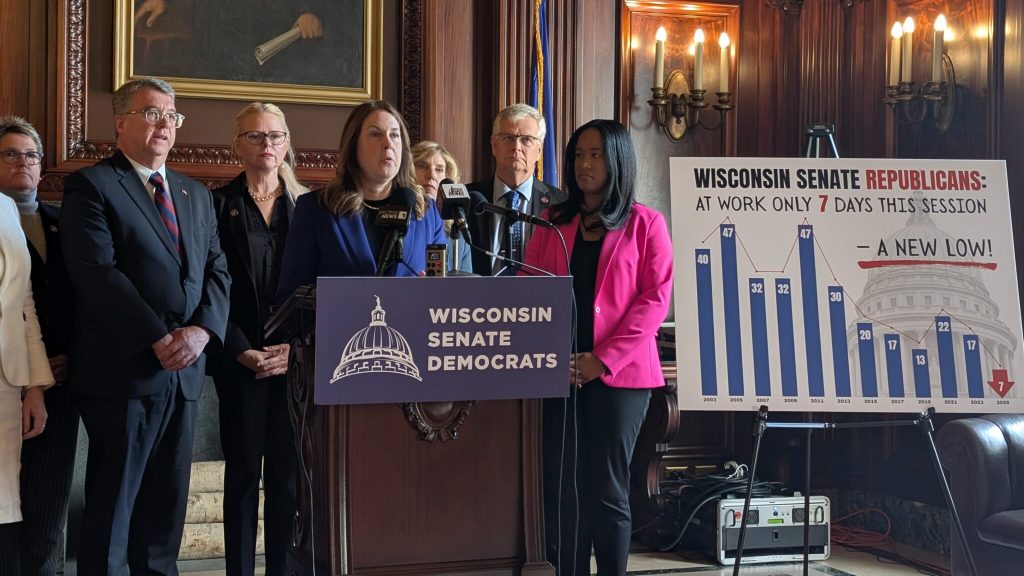 Democrats displayed a poster that showed the number of times the Senate has met per legislative session from 2003 to 2025. (Baylor Spears/Wisconsin Examiner)