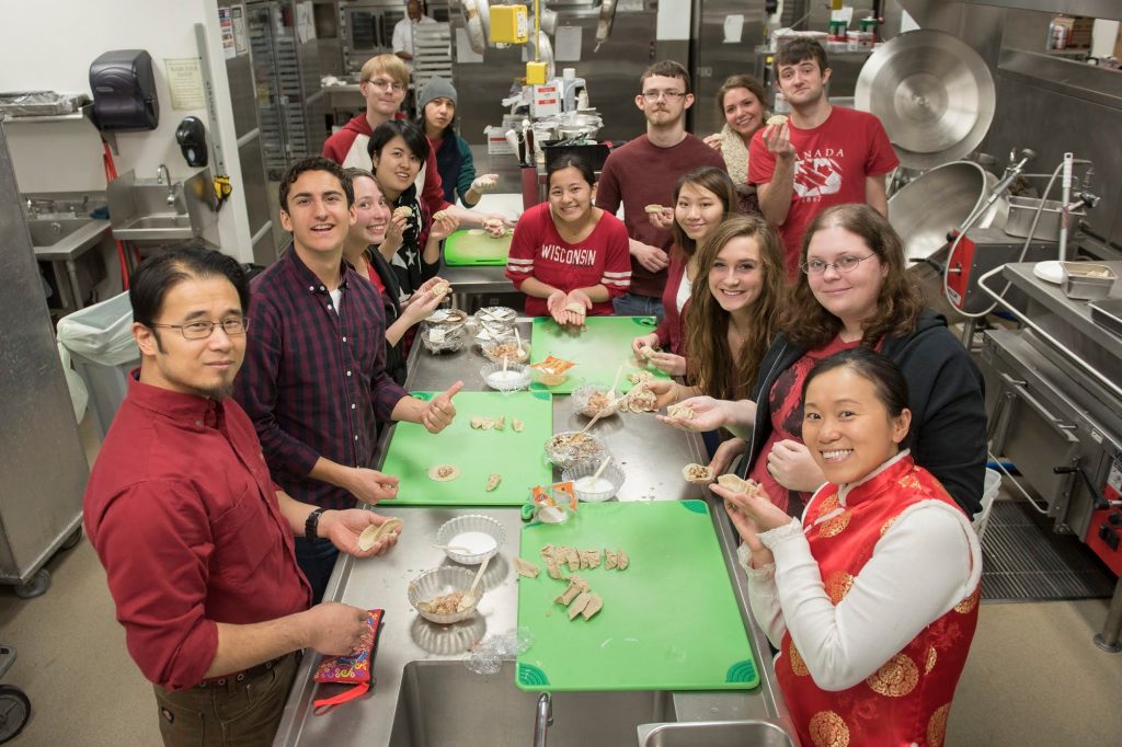 Kaishan Kong, bottom right, leads a dumpling-making class for her students at UW-Eau Claire. Photo courtesy of Kaishan Kong