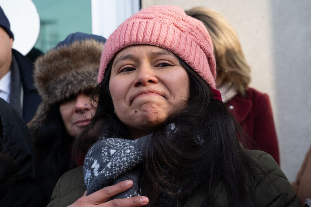 Yessenia Ruano puts a hand to her heart before a check-in at the Milwaukee branch of Immigration and Customs Enforcement on Feb. 14, 2025. Photo courtesy of Voces de la Frontera