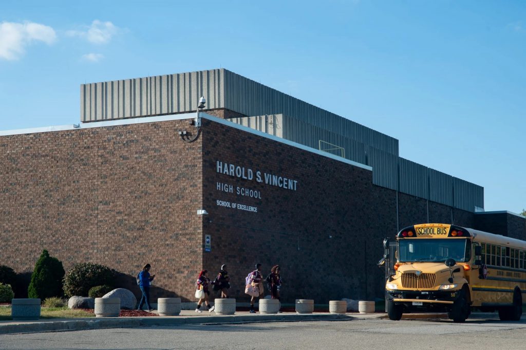 Students walk onto a bus at Harold S. Vincent High School on Thursday, Oct. 11. Five of the six use-of-force incidents last school year involving the Milwaukee Police Department occurred at Vincent. (Photo by Jonathan Aguilar / Milwaukee Neighborhood News Service / CatchLight Local)