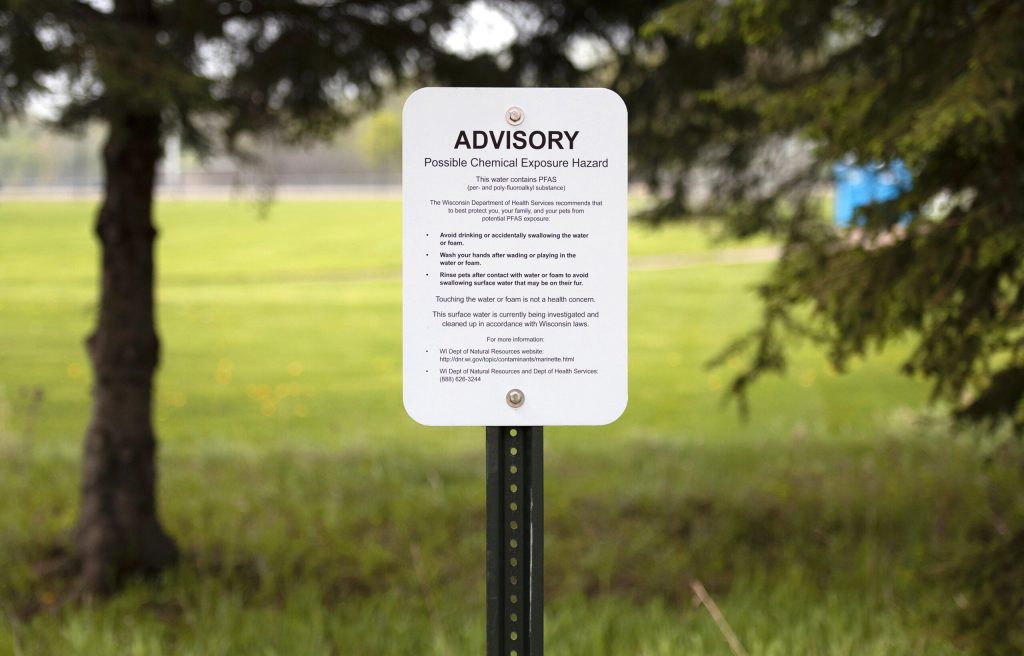 A sign at Marinette High School warns of PFAS contamination in water that runs through the school’s campus Thursday, May 20, 2021. Angela Major/WPR
