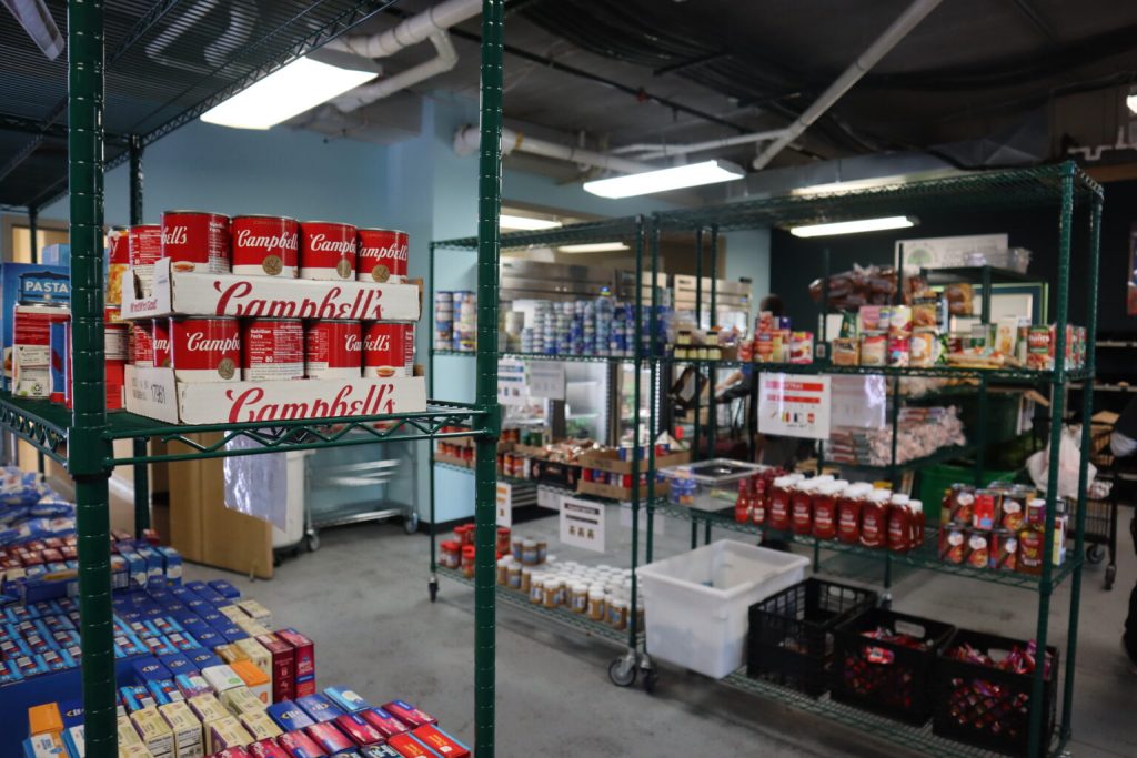 Food stocked on shelves within the Rooted & Rising food center in Milwaukee. (Photo by Isiah Holmes/Wisconsin Examiner)