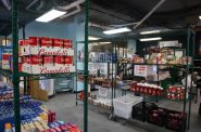 Food stocked on shelves within the Rooted & Rising food center in Milwaukee. (Photo by Isiah Holmes/Wisconsin Examiner)