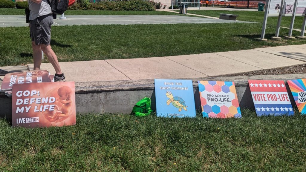 Signs at a pro-life rally outside of the Republican National Convention in 2024. (Photo by Baylor Spears/Wisconsin Examiner.)